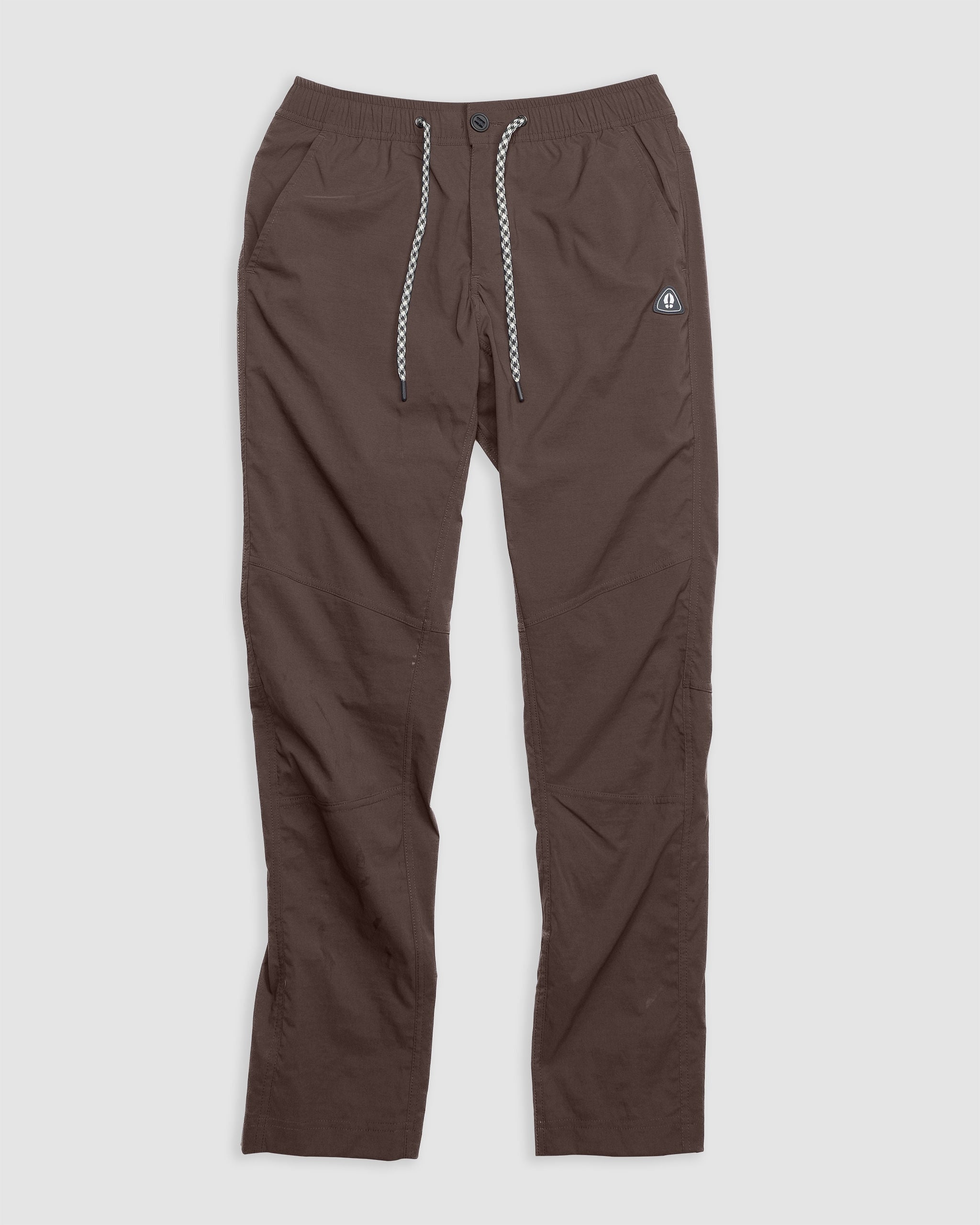 BEARDEDGOAT NEW—ROVER™ Pant in Chickory: relaxed fit, front button, drawstring waist, and embroidered logo on the left thigh. Made from performance stretch nylon for durability. Shown on a plain white background.