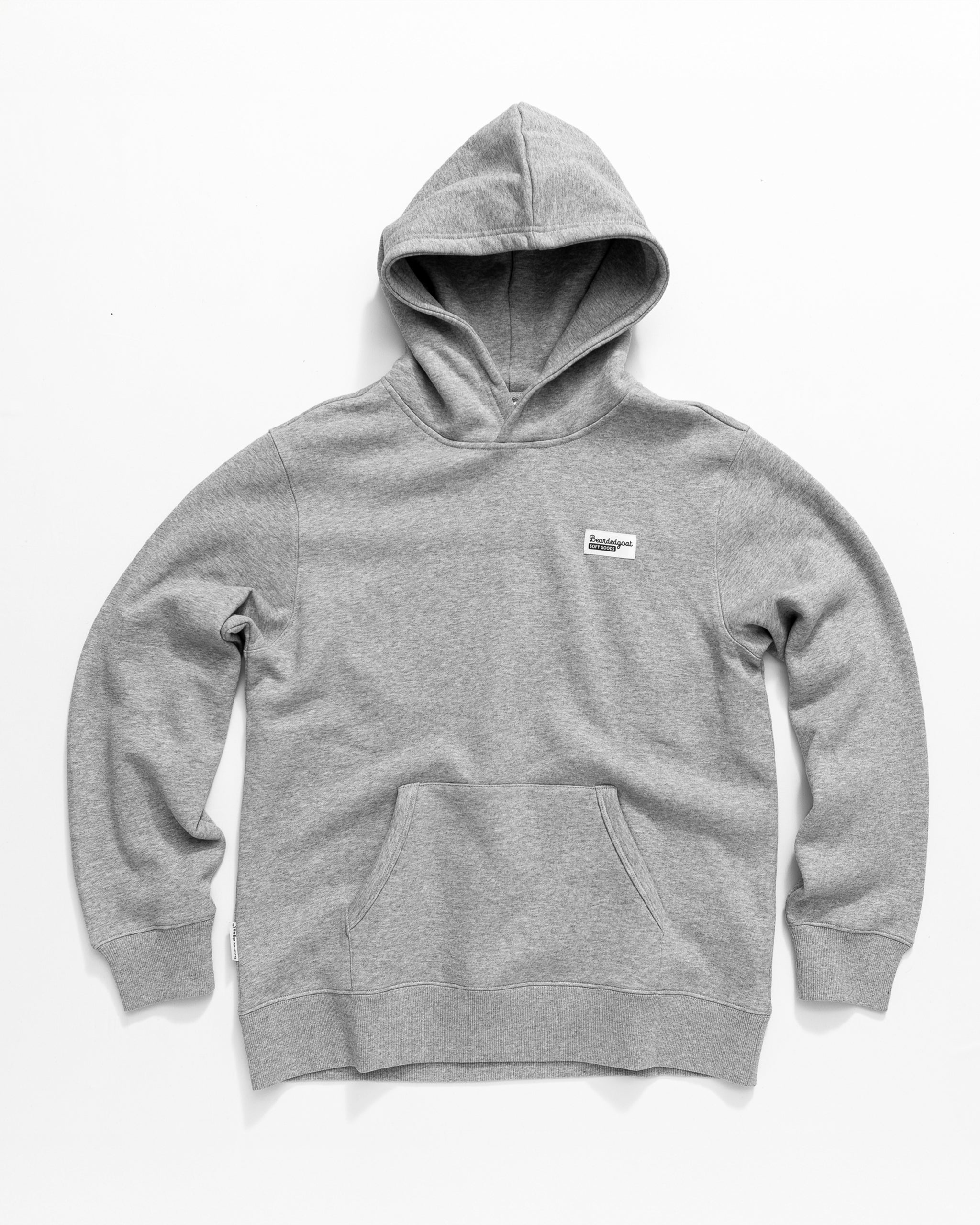 The beardedgoat Men's Void Hoodie is a heavyweight cotton, light gray hoodie with a front pocket and a small white rectangular label on the left chest, shown laid flat on a white background.