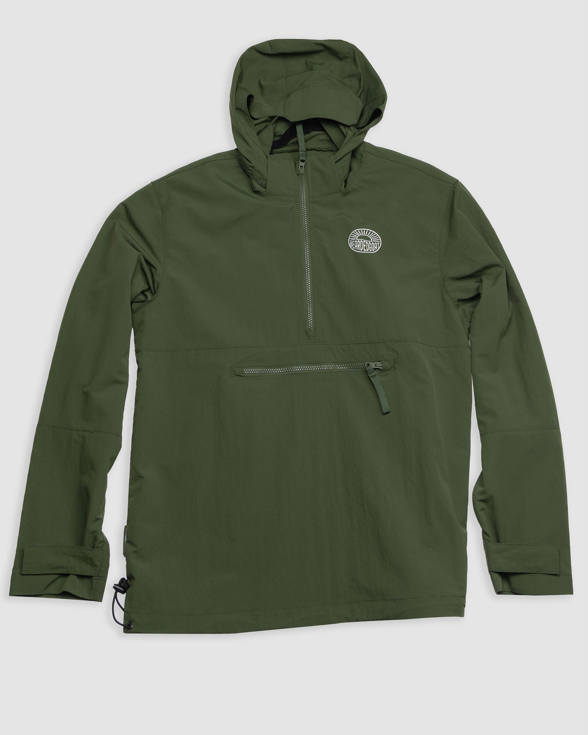 The BEARDEDGOAT Mens Deluge Pullover is a forest green, water-resistant jacket with a hood, chest zipper pocket, half-zip front, Velcro cuffs, side drawcord, and small circular left chest logo. Shown laid flat on a light gray background.