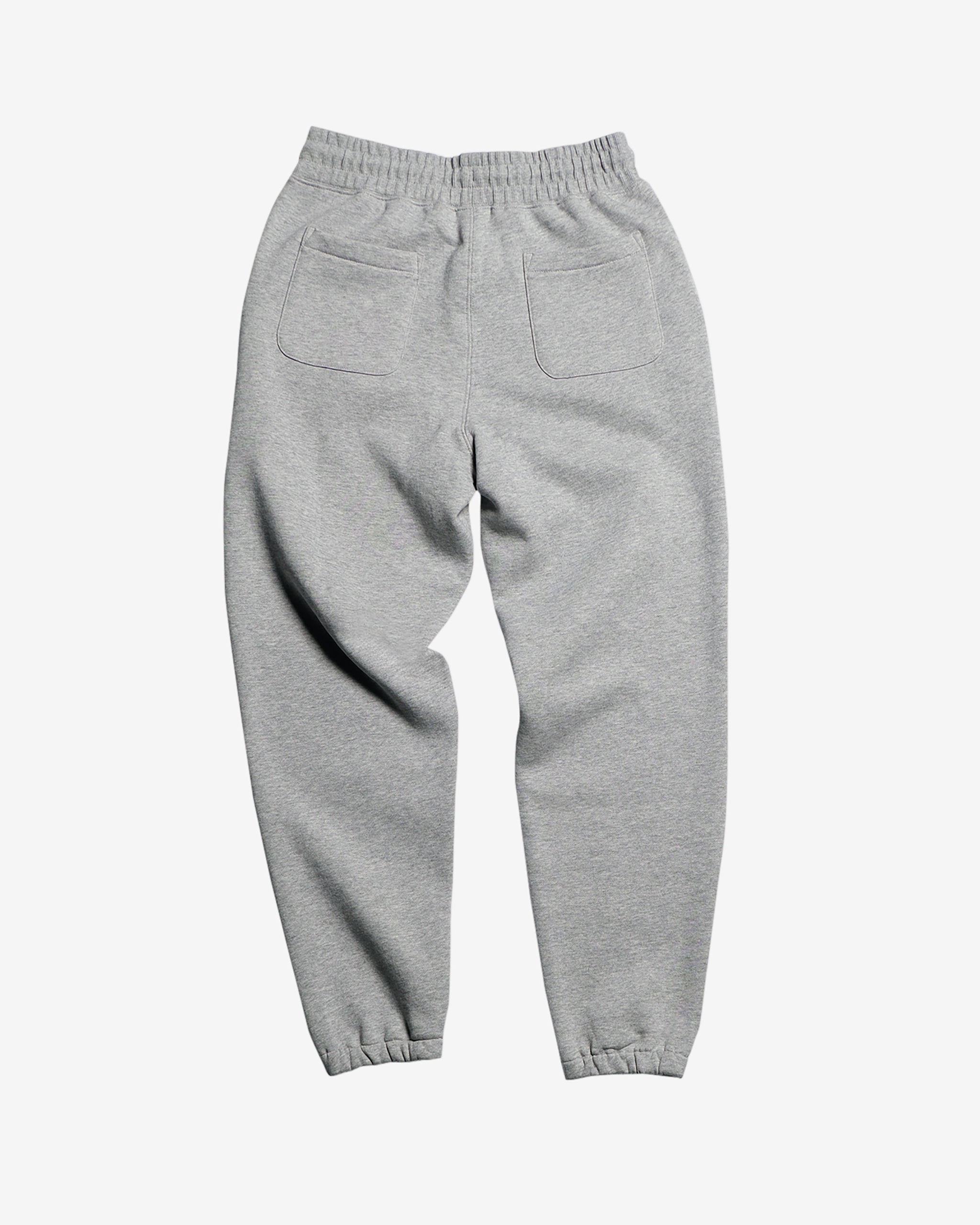 The BEARDEDGOAT Women’s Overnight™ Classic Jogger features a high-rise waistband, elastic cuffs, and two square back pockets. Shown from the back, these soft heavyweight fleece sweatpants are displayed flat on a plain white background.
