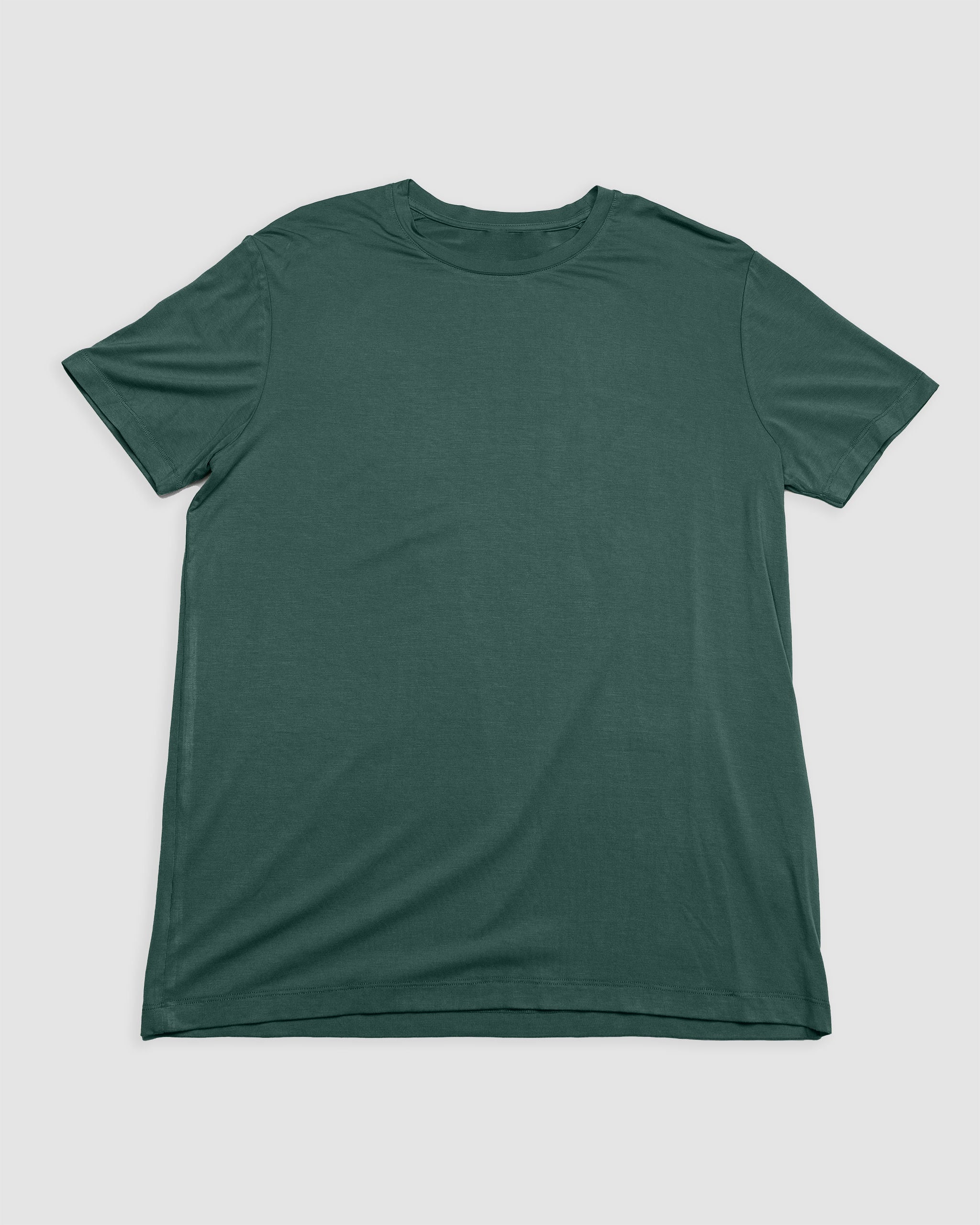 A Men’s EverZen™ Short Sleeve t-shirt by BEARDEDGOAT in Cypress, designed for performance comfort, is laid flat on a white background.