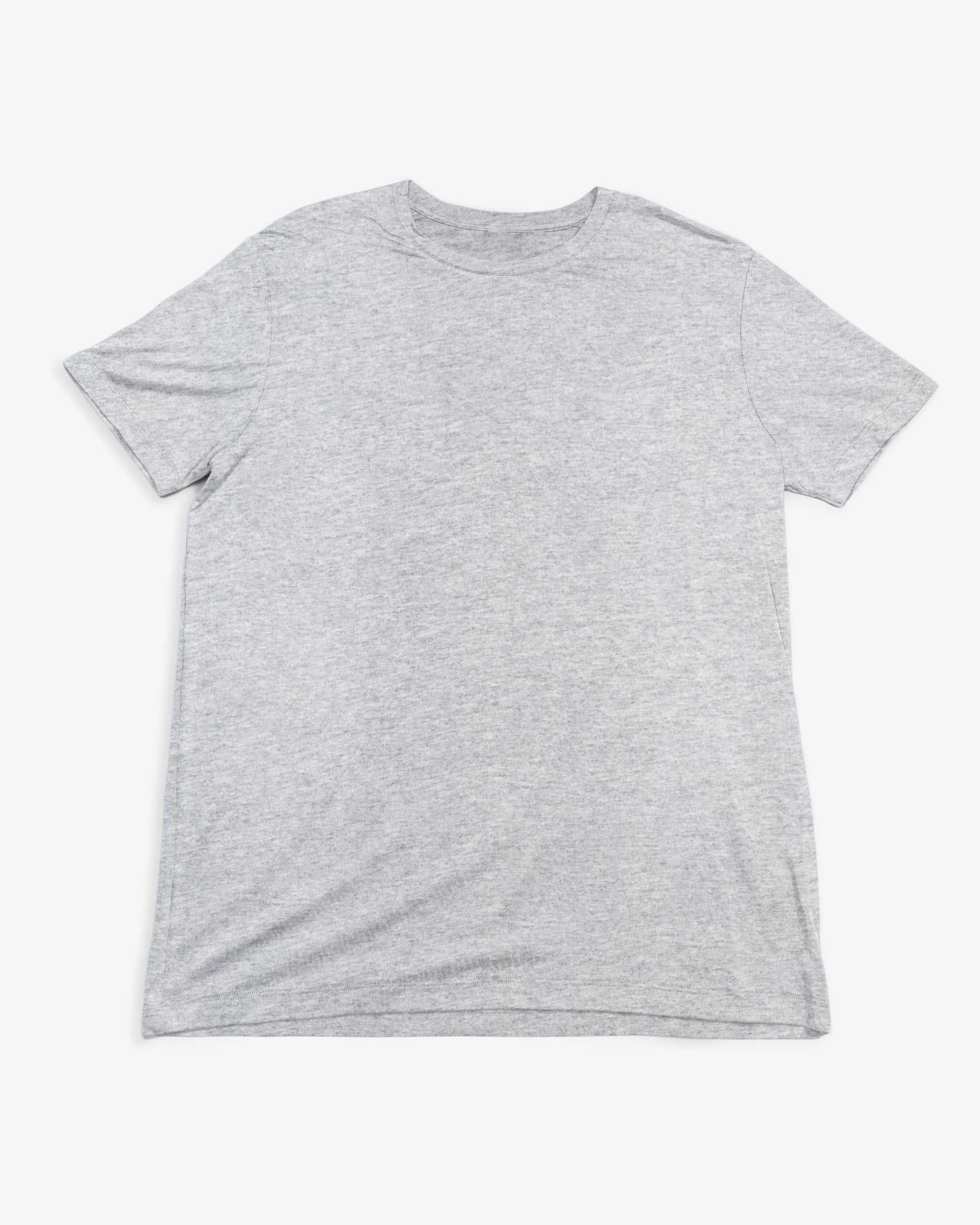 The BEARDEDGOAT Men’s EverZen™ Short Sleeve in heather grey is a classic crew neck T-shirt laid flat on a white background, combining timeless style with performance comfort.