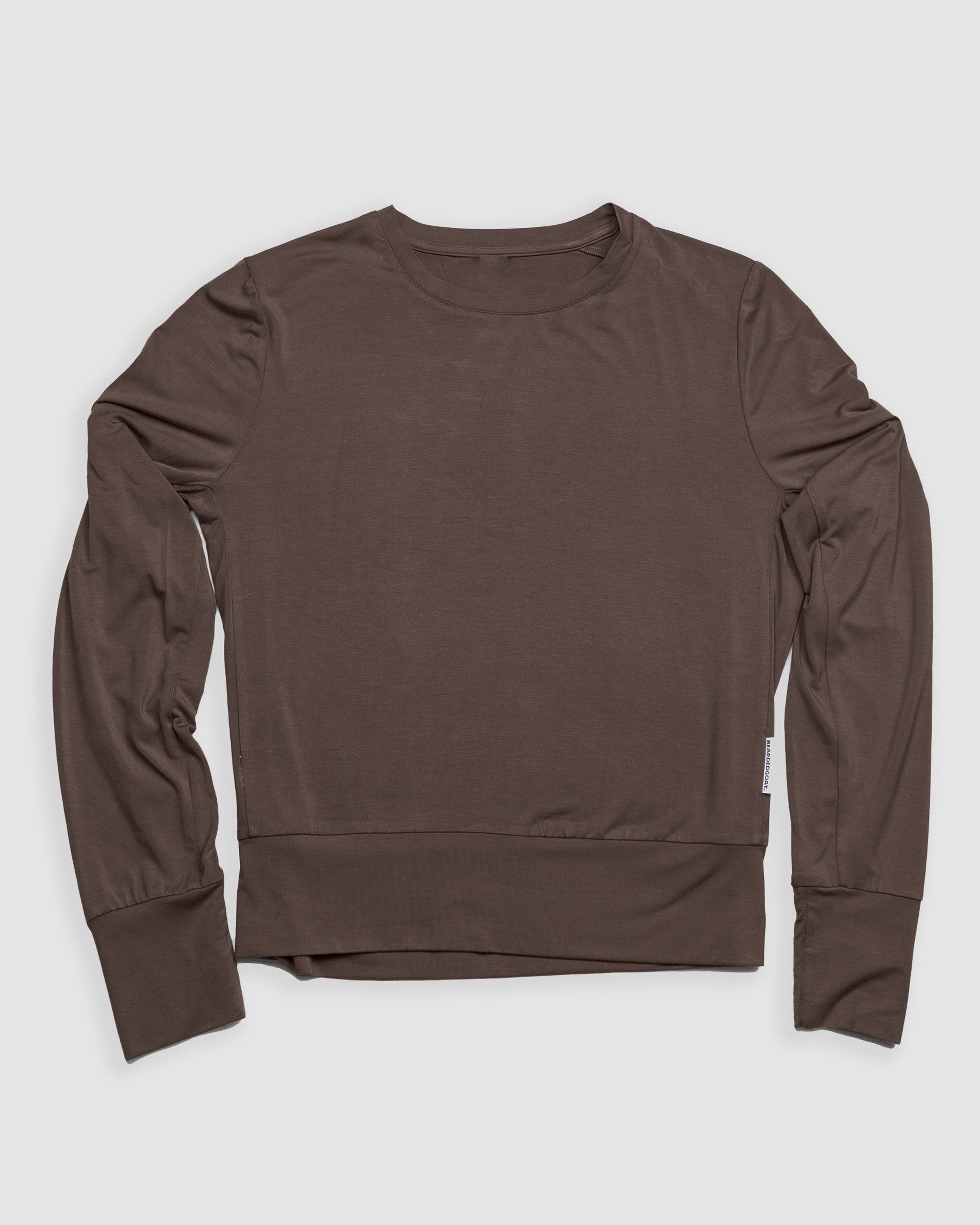 The BEARDEDGOAT Women’s EverZen™ Bamboo Long Sleeve, a brown crew neck shirt with a relaxed fit and no visible patterns or logos, is laid flat on a light gray background. Made from a sustainable bamboo blend.