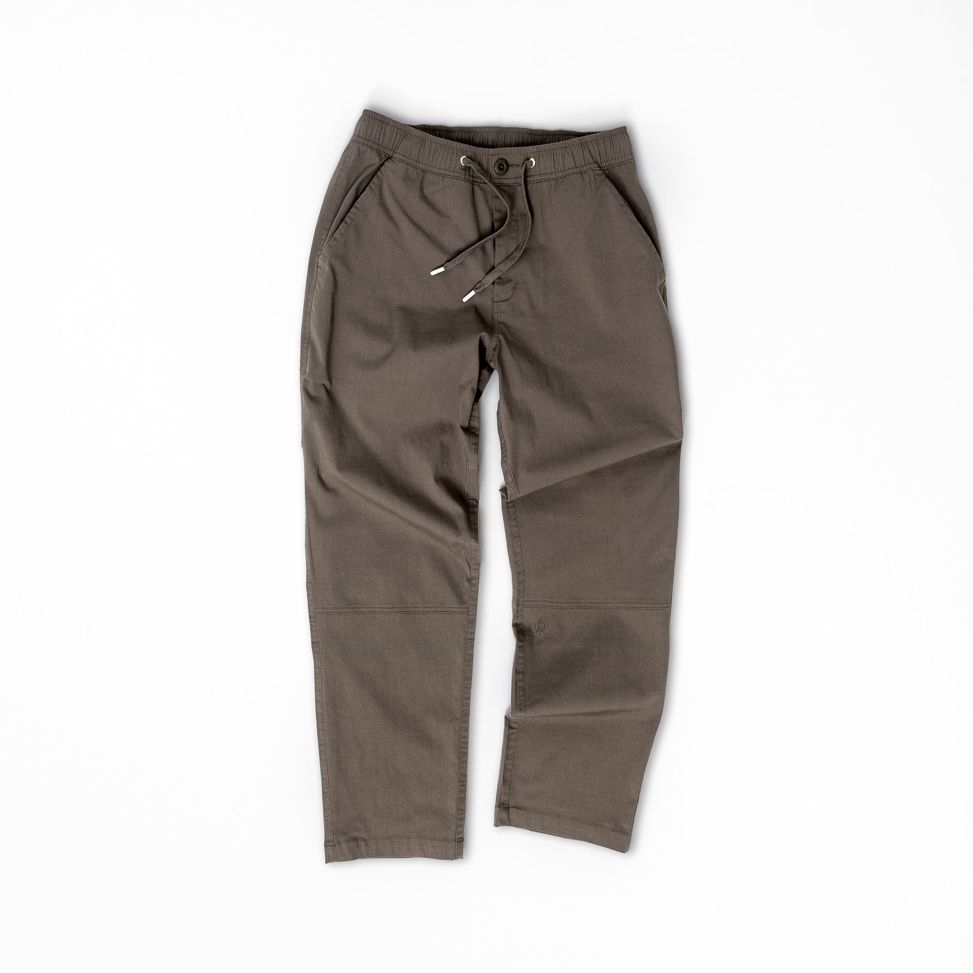 A pair of beardedgoat Mens Dock Pant in olive green with a relaxed fit, elastic drawcord waist, two side pockets, and visible stitching, laid flat on a white background.