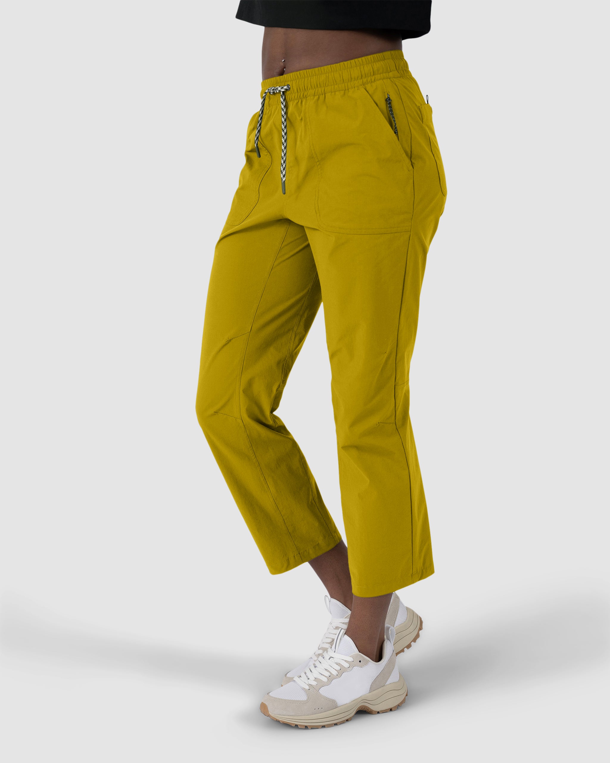 A person wearing BEARDEDGOAT's new Summit™ Pant in yellow lightweight ripstop.