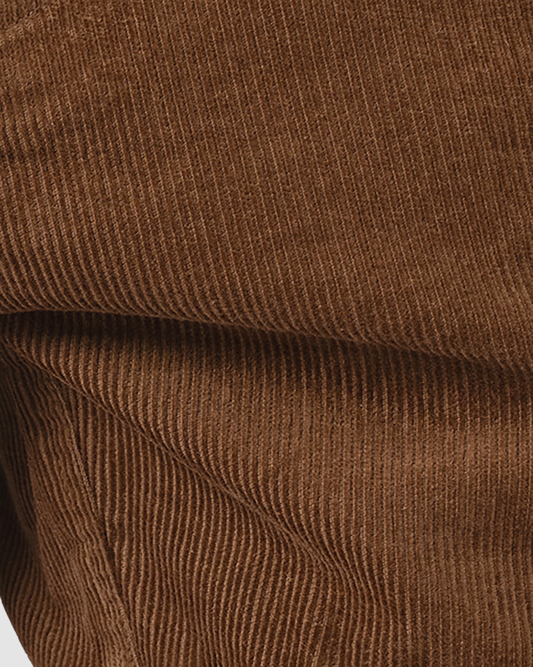 Close-up of BEARDEDGOAT’s Mens Cord Short in brown corduroy, featuring vintage-inspired vertical ribs and a soft, velvety finish—ideal for a timeless look.