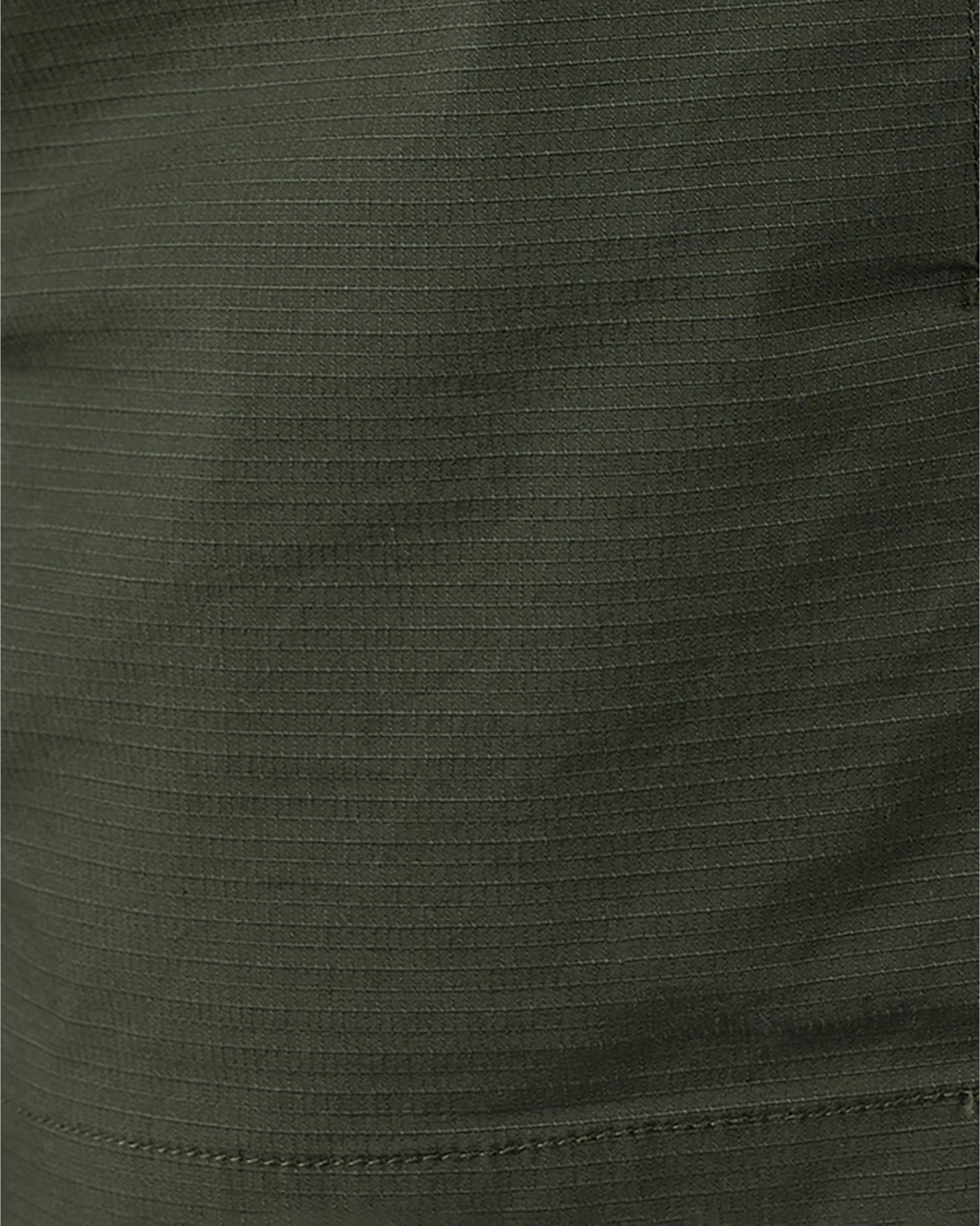 Close-up of olive green stretch cotton ripstop fabric with a subtle grid pattern showcases the Womens Canopy Short by BEARDEDGOAT, highlighting breathable comfort, visible stitching, and the short’s durable, detailed texture.