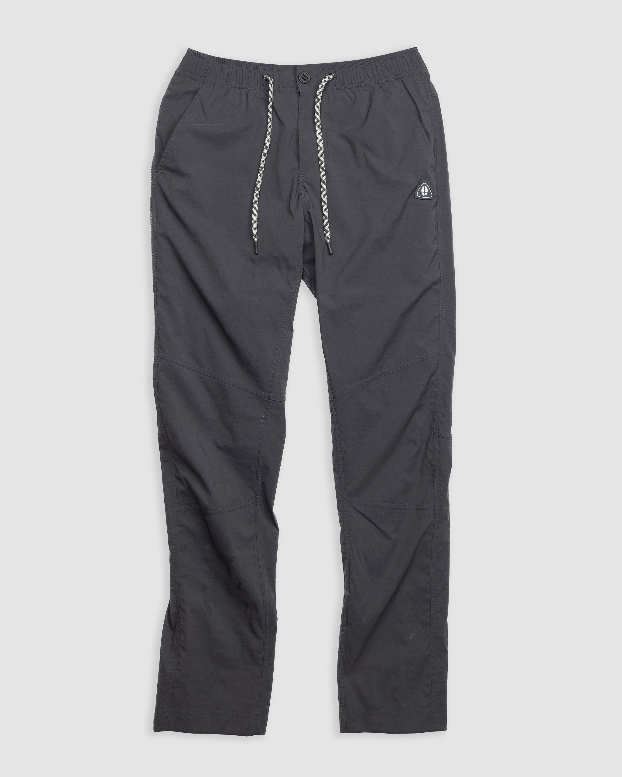 The BEARDEDGOAT NEW—ROVER™ Pant in Mid Night Navy features performance stretch nylon, an elastic waistband, button closure, zip fly, and a small logo on the left thigh—durable outdoor pants ready for any adventure.