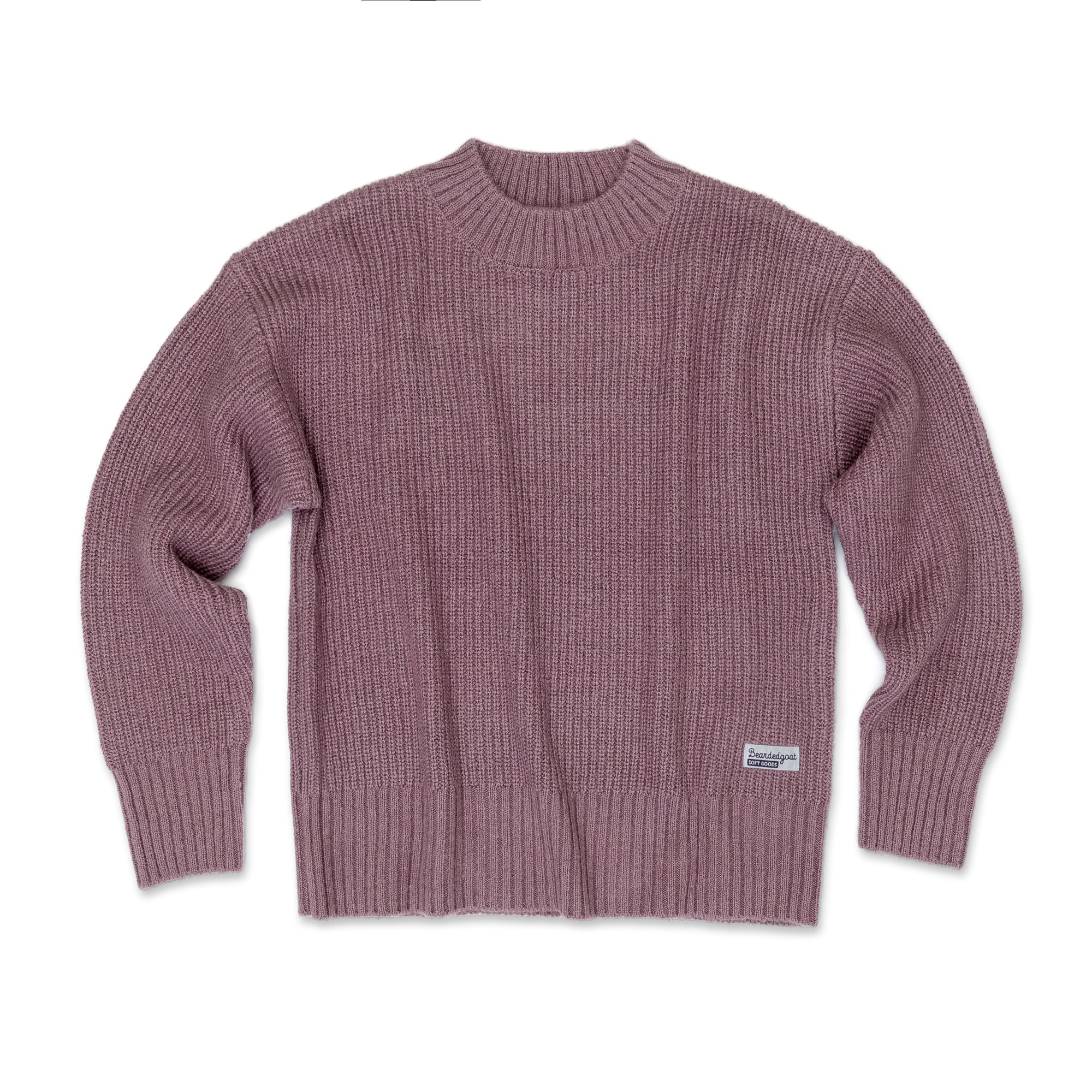 The Womens Basin Waffle Sweater by beardedgoat, in mauve with long sleeves, ribbed knit, crew neck, and a small white label on the lower left hem, is shown laid flat on a white background.