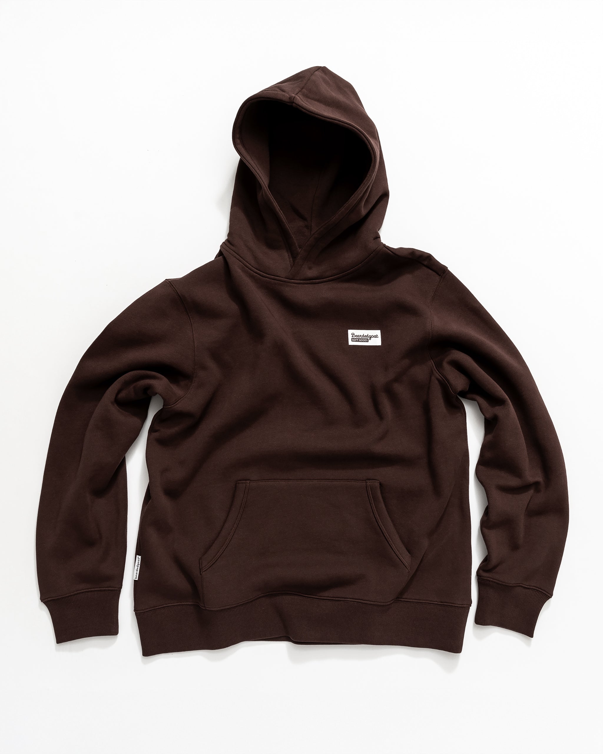 The beardedgoat VOID™ Hoodie, dark brown and made from premium heavyweight cotton fleece, features a hood, front kangaroo pocket, and a small white chest label, shown laid flat on a white background.