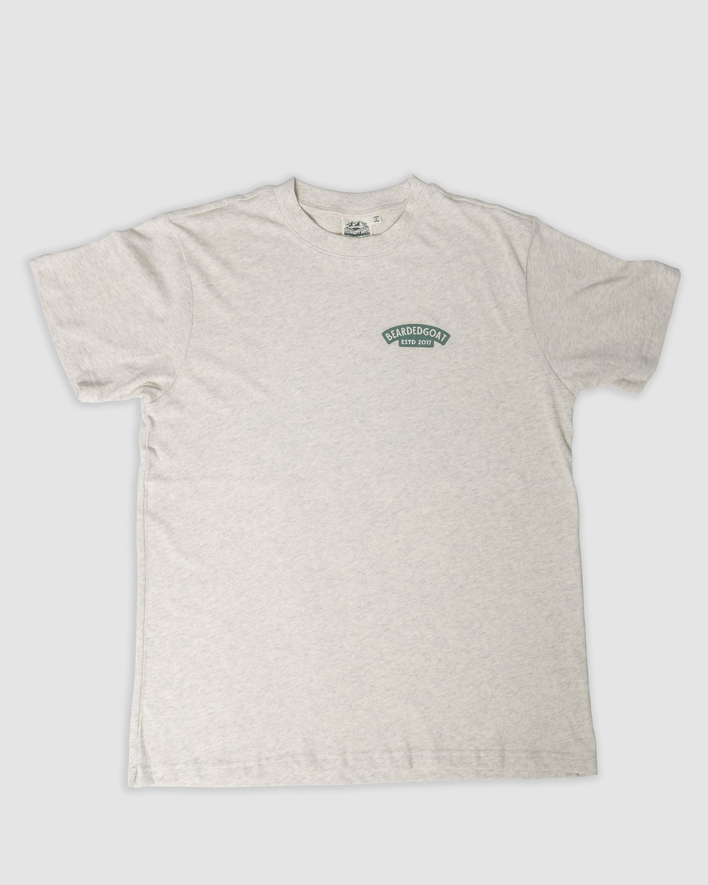 The BEARDEDGOAT Pine Tee in Snow Grey is a short-sleeve, heavier cotton shirt with a small green logo on the left chest, shown flat on a plain white background.