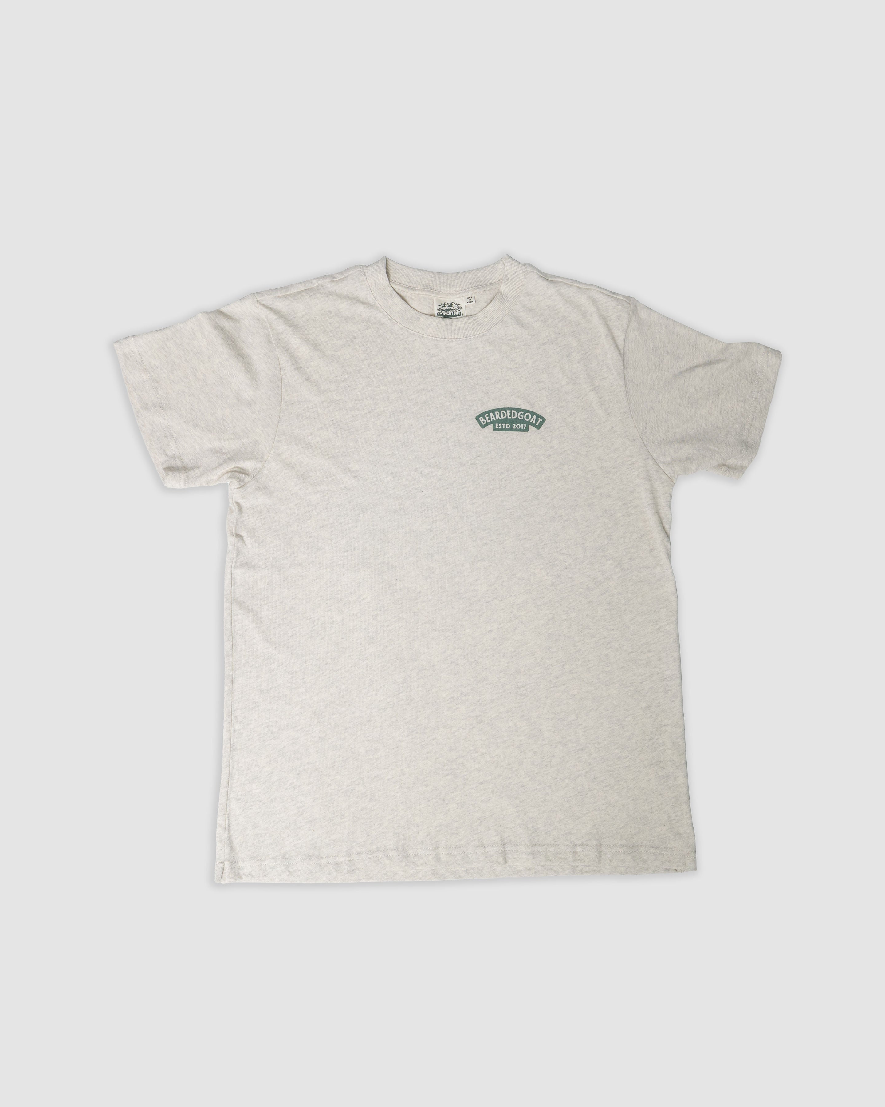 The BEARDEDGOAT Pine Tee in Snow Grey is a short-sleeve, heavier cotton shirt with a small green logo on the left chest, shown flat on a plain white background.