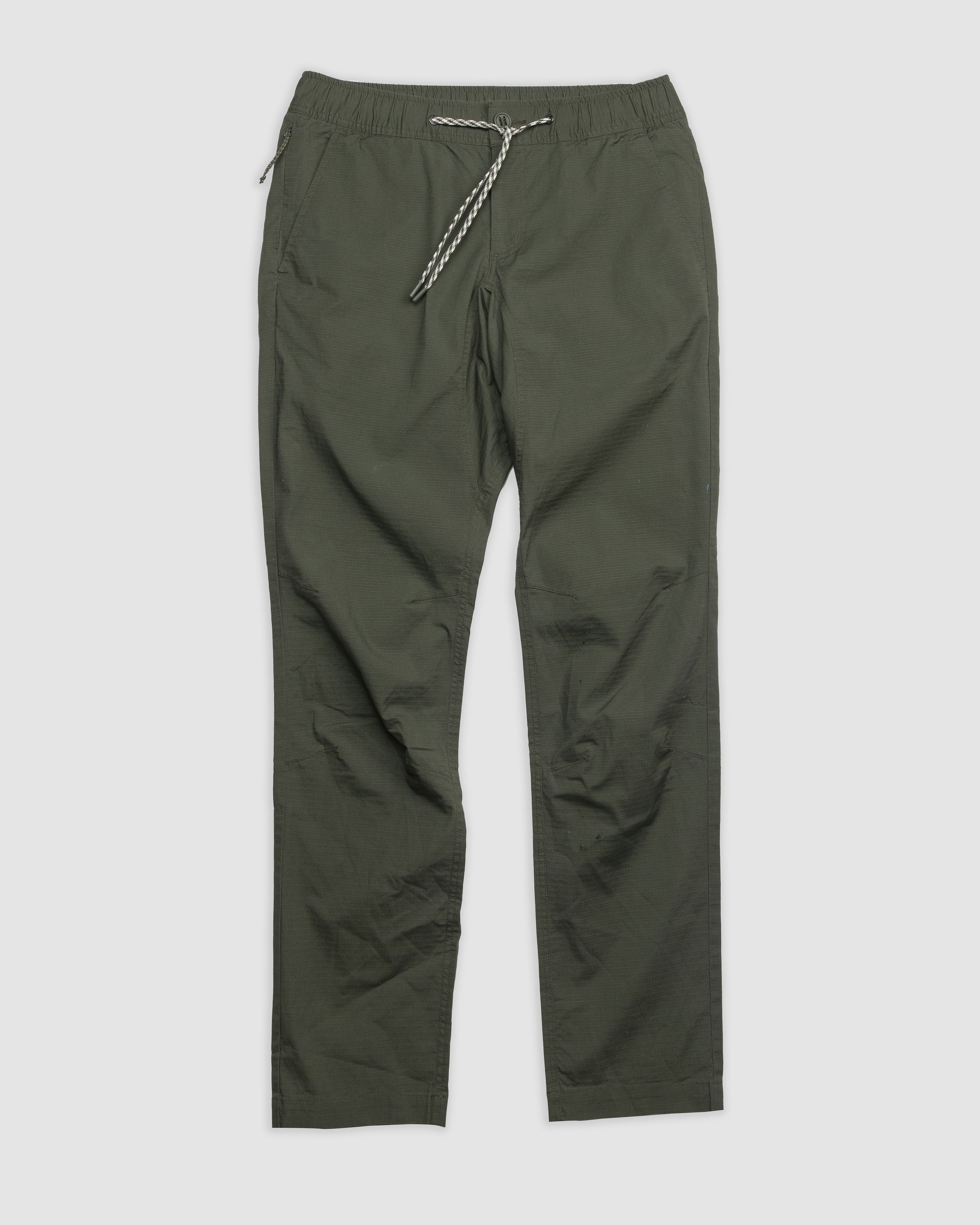 The BEARDEDGOAT Men's Canopy Pant in olive green features an elastic waistband and a white-and-black drawstring, shown flat on a light background.